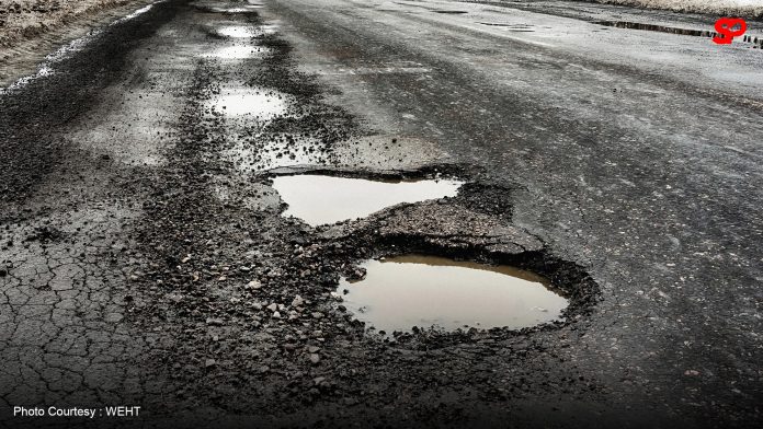 Potholes on Pagbilao highway cause delays during holiday season