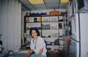 Richie Carrido on the floor of St. Vincent's Hospital Oncology unit, New York City — the same hospital where she would later serve as a triage nurse in the aftermath of the September 11, 2001 attacks. Decades later, she returned to the United States as Grandison's 300th deployed nurse through the Grandison Secure Placement Program.